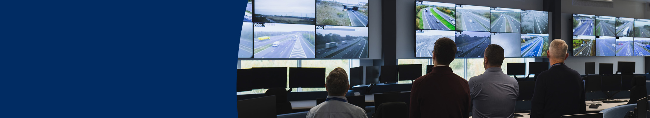 four control room operators view images of road networks