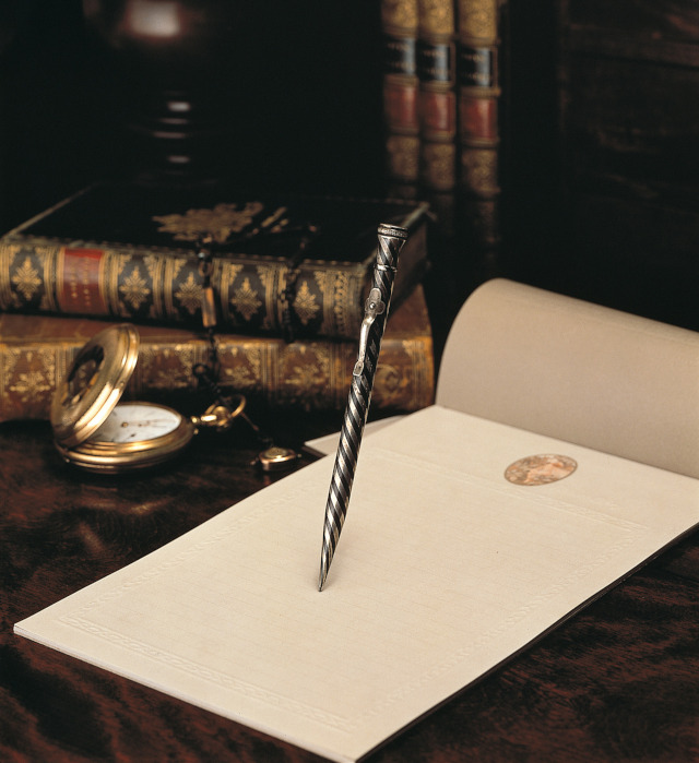 A writing implement and a piece of paper