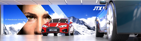 A huge LED wall in a car showroom shows a mountain scene