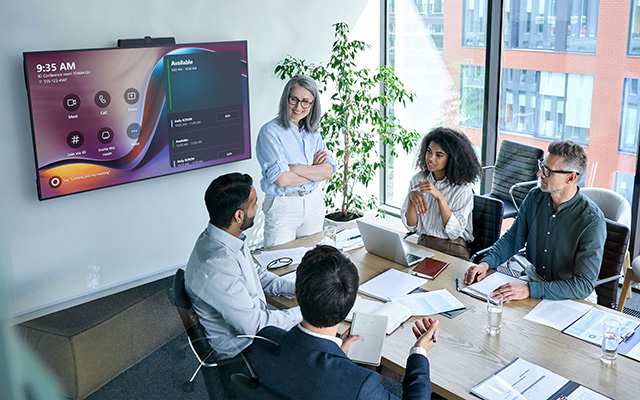 People gathered around a meeting room table