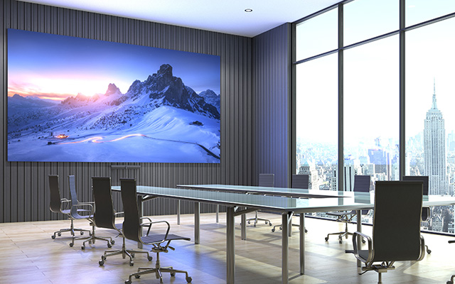 A large wall mounted LED display in a boardroom