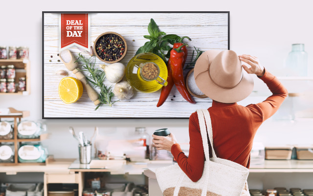 A woman wearing a hat in a sustainable shop